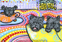 Cairn Terrier dogs on spinning tea cup ride