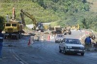 One lane at Km13 of the Kampung Raja-Pos Slim road being cleared for traffic at 6am yesterday. A mudslide made the road impassable on Tuesday.