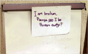 Note on a flipchart: I am broken. please can I be thrown away?