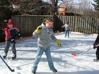 Kate getting into the backyard hockey action