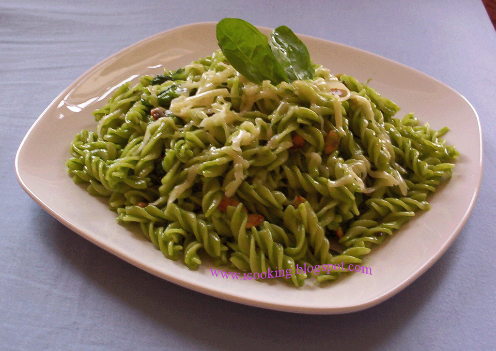 International Cooking Fusilli pasta with green spinach saucea Italian 