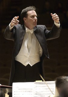 Conductor Ryan Brown, employing his trademark two-finger technique