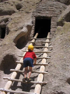 Mini-Critic at Bandelier, climbing up to a cliff dwelling