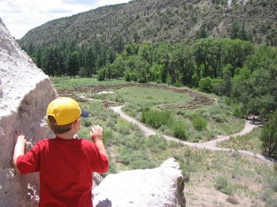Mini-Critic at Bandelier, from the cliff dwellings, overlooking the Tyuonyi pueblo ruin