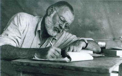 Ernest Hemingway, writing in Kenya, 1953