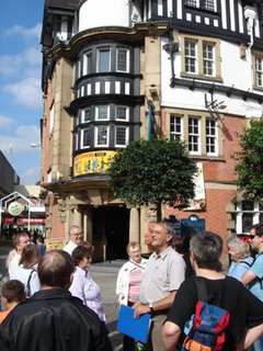 Kevin Dranfield addresses the group outside The While Lion, Kath Taylor looks on