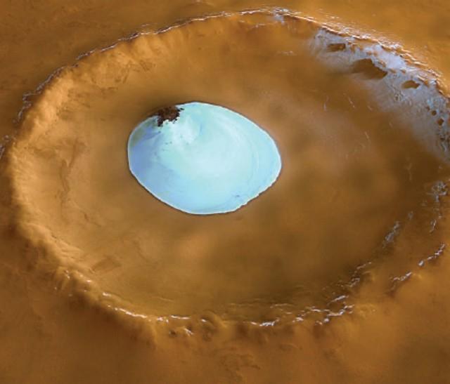 Frozen lake gleaming in the sun at the bottom of a martian crater