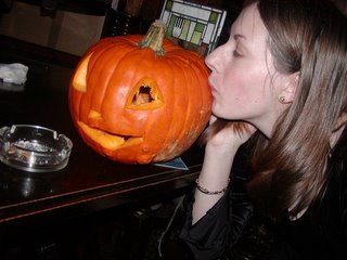 Nat kissing Eric the pumpkin on the cheek