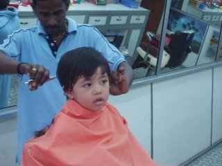 Chastan having haircut