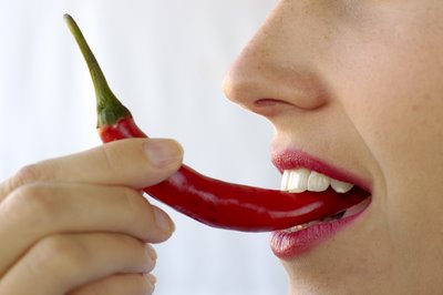 woman eating hot pepper