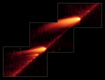 Numerous fragments of Comet Schwassmann-Wachmann 3 as seen by the Spitzer Infrared Space Telescope.  Fragment B is to the bottom left, and Fragment C is to the top right.