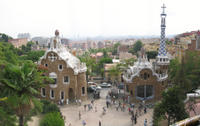 Parc Guell's gatehouse and the view across Barcelona to the sea
