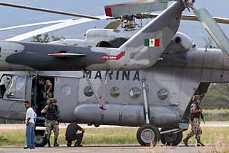 Mark in Mexico, http://markinmexico.blogspot.com/, Pale Horse Galleries, http://palehorsemex.vstore.ca/, Oaxaca, Mexico: Military helicopters and troops arrive at Oaxaca's airport this afternoon after overflying the city for two hours photographing the street blockades and other APPO concentrations.