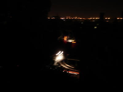 The traffic circle below my window, dark