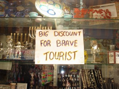 Sign in gift store on the pedestrian mall downtown: “Big discount for brave tourist”