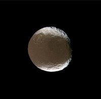 Saturn's two-faced moon tilts and rotates for Cassini images acquired during the spacecraft's close encounter with Iapetus.