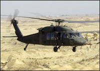 by Courtesy of DoD January 26, 2004 A UH-60L Blackhawk helicopter flies a low-level mission over Iraq. Army aviation assets are playing a key role in Operation Iraqi Freedom and the Global War on Terrorism. Photo courtesy of the Department of Defense. This photo appeared on www.army.mil.