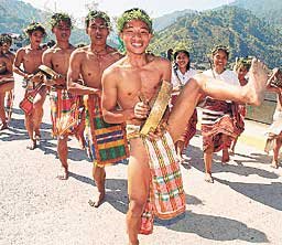 Bontoc students in their colorful costumes dance the traditional way as they join nine other tribes in the Mt. Province during yesterday’s celebration of the ‘Lang-ay’ festival, the traditional way of sharing happiness and festivities to strenghten family ties.