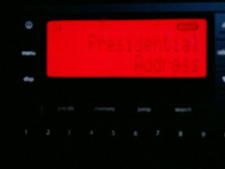 An out of focus picture of my XMRadio display as I listened to President Bush speak to the Illegal Alien problem.