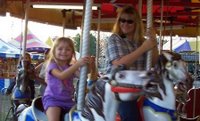 Shan and Emily on the carousel