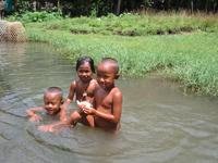 Balinese kids enjoy a bath