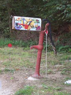 Old water pump holding up mailbox