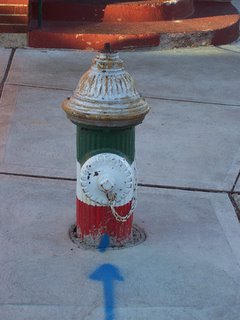 Fire hydrant painted in the colors of the Italian flag