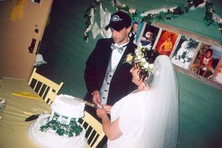 Al, Stacy, and the wedding cake-by Joe Blades 2005