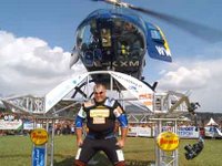 Strongman lifts helicopter