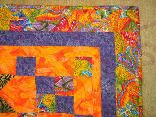 a closeup that shows the quilting pattern and thread colors in detail