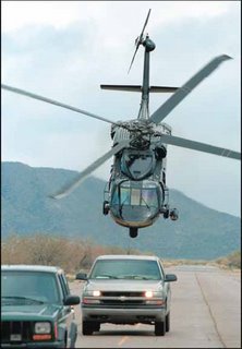 A CBP Blackhawk swoops down on “bad guys” near the southwest border of the U.S.