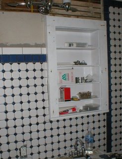 tiled wall with medicine cabinet