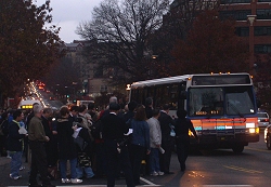 Another packed bus takes off for Farragut North.