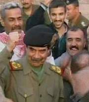 Saddam after winning a Dhadi (the Iraqi equivalent of a Tony/BAFTA)