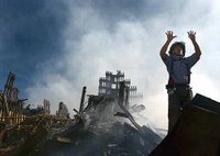 A New York City fireman calls for 10 more rescue workers to make their way into the rubble of the World Trade Center, Sept. 15, 2001. Photo by Photographer's Mate 1st Class Preston Keres, USN
