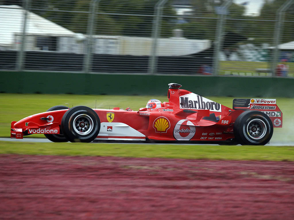 Формула 1 2005. Феррари ф1 2005. Ferrari f2004 Schumacher. Рубенс Баррикелло 2005. Феррари 2005 формула 1.