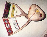 rawhide rattle, with beadwork, by Eric Keast; Broken Vulture Art.