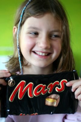 photograph picture of Mollie and a packet of six mars bars