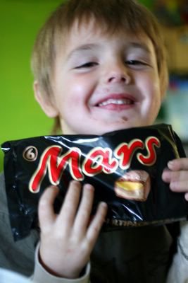 photograph picture of Ben and a packet of six mars bars