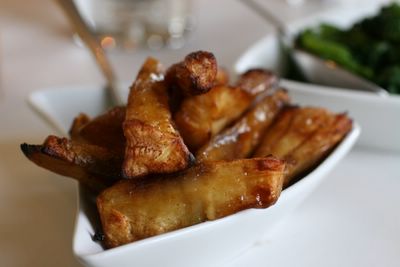photograph picture  of roast parsnips with golden syrup & mustard at the Old Passage Inn at Arlingham, Gloucestershire, England