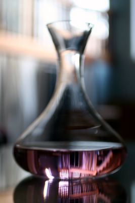 photograph picture of wine decanter filled with faux rose