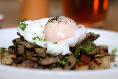 photograph picture of poached eggs on a bed of pancetta, shiitake & button mushrooms and croutons?
