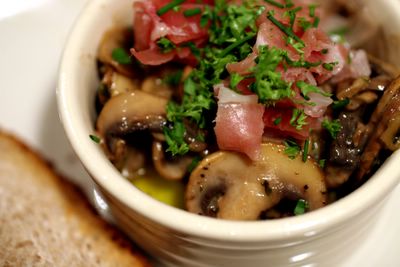 photograph picture of oeufs en cocotte with creamy sherry & thyme mushrooms and prosciutto recipe