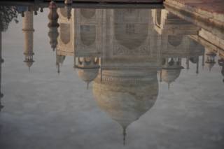 Reflection of the Taj Mahal in one of the pools, at sunset