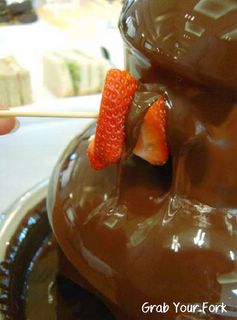 strawberries cavorting under the chocolate fountain