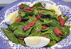 picture of spinach salad with hot bacon dressing and eggs