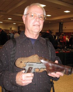 The original seller with the pistol. After purchasing it, I found him and asked him to pose with it.