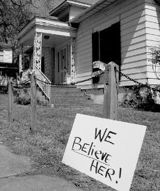demonstration sign at 610 N. Buchanan-'We Believe Her'