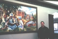 Roland Lee with library mural