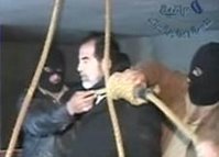 Video image released by Iraqi state television shows Saddam Hussein's guards wearing ski masks and placing a noose around the deposed leader's neck.